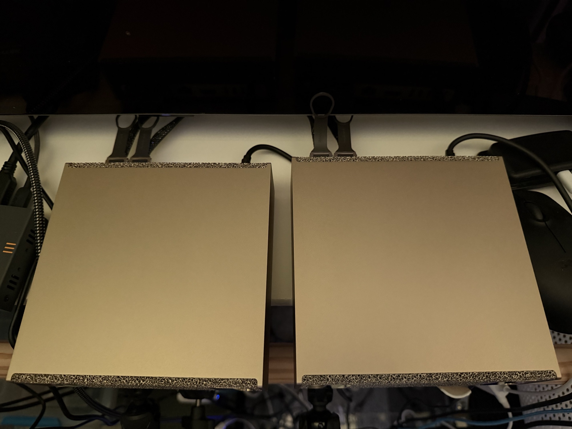 Both Sparks on the bench, joined by the two QSFP cables